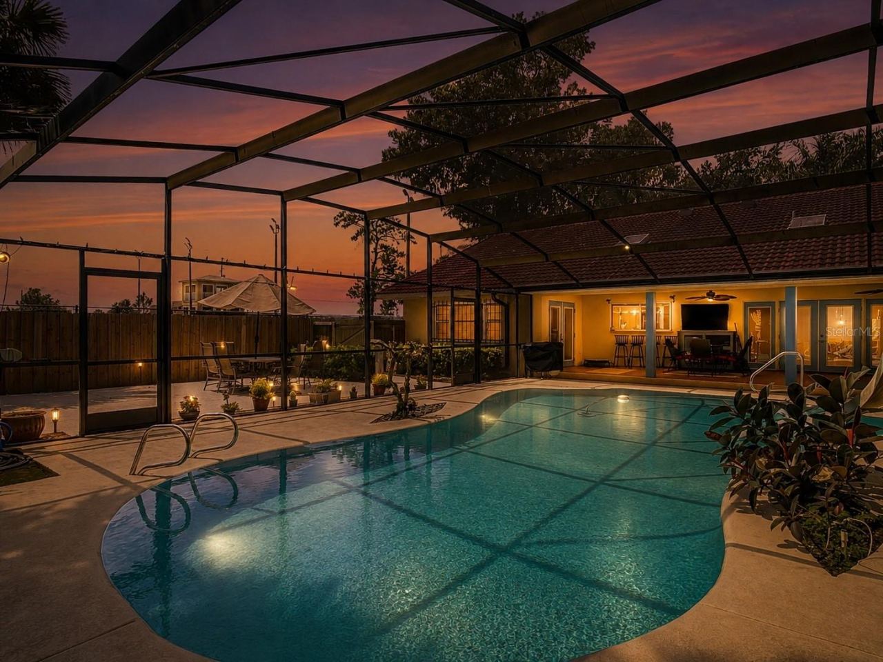 Photo 2 of 20: backyard oasis, screened pool and covered lanai, turf patio.