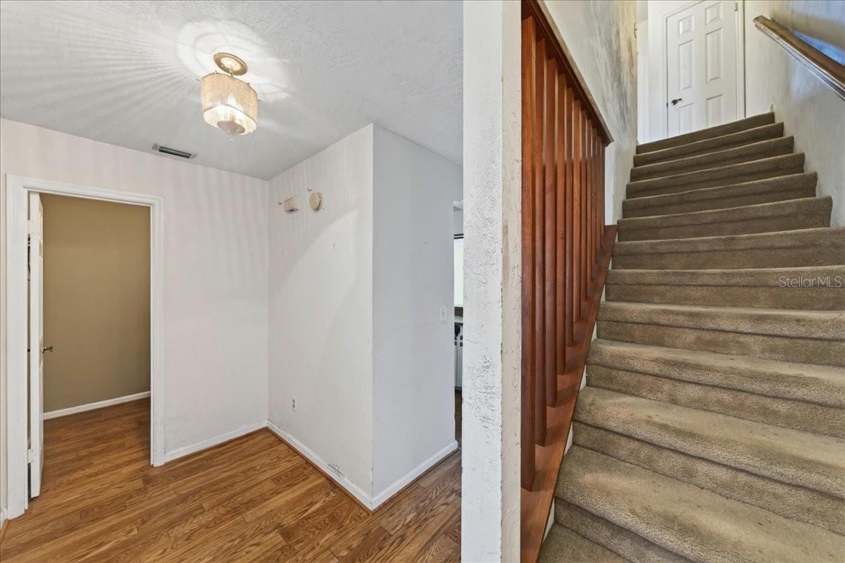 Photo 5 of 20: Unit 841 Foyer and stairs to the bedrooms