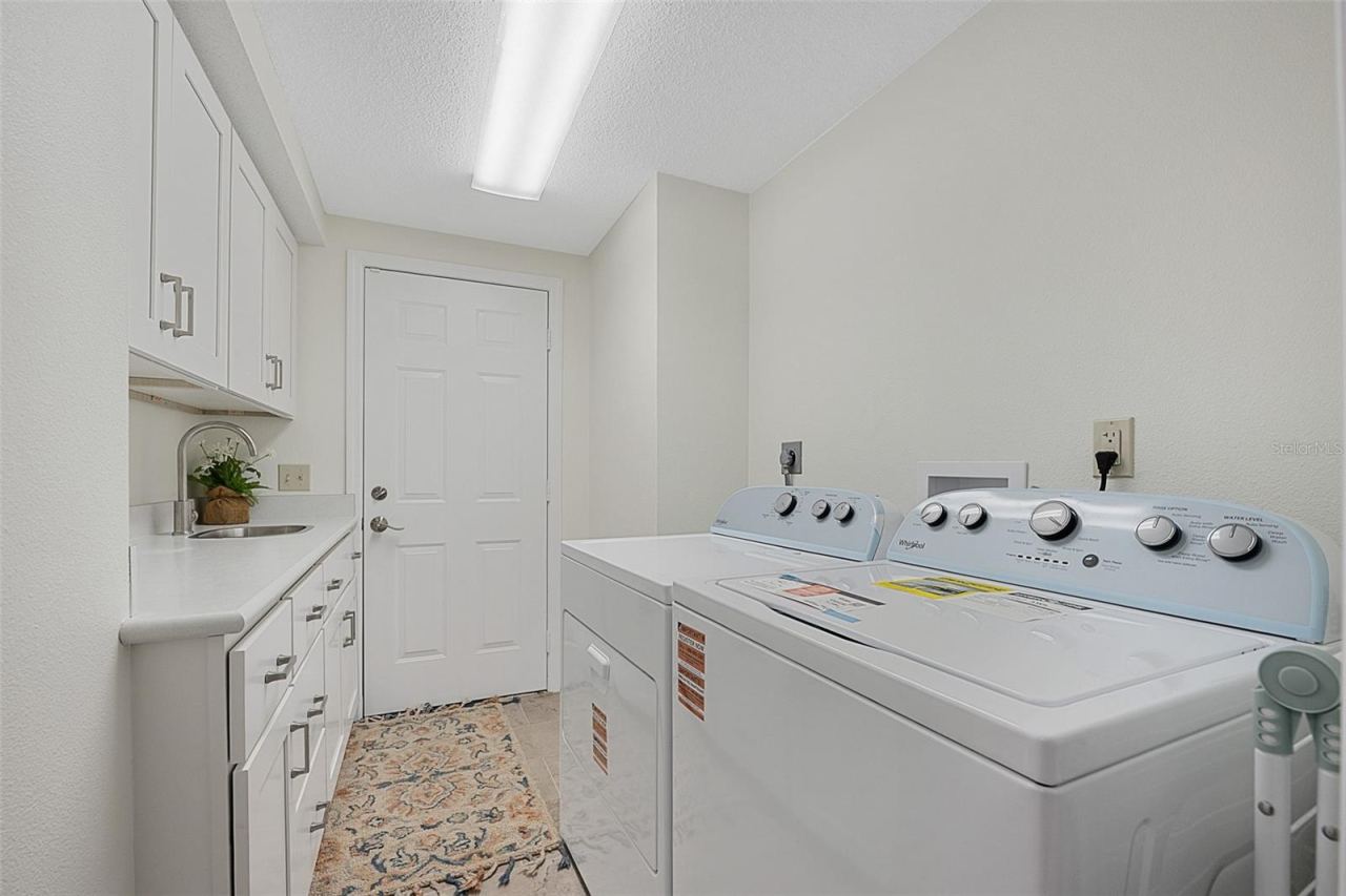 Photo 20 of 20: Laundry room with brand new W/D and cabinets