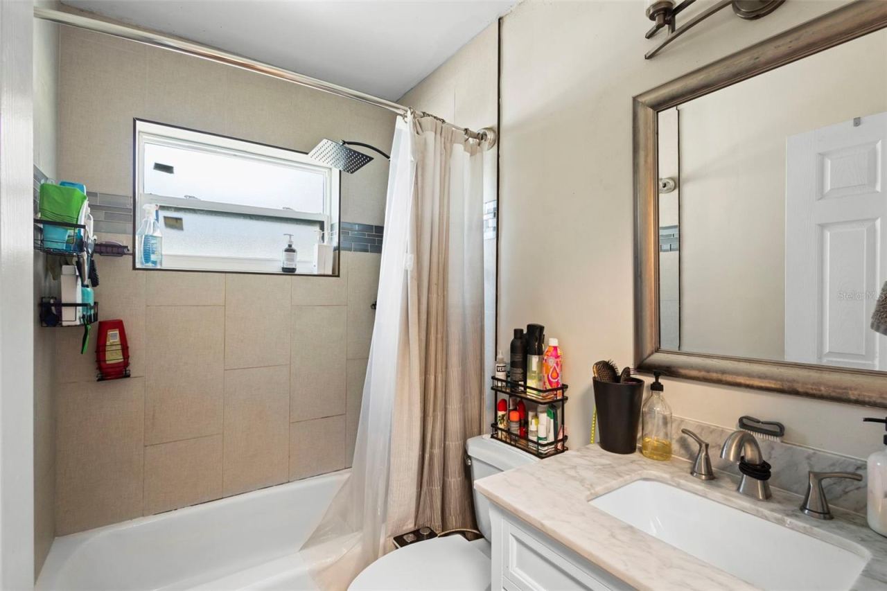 Photo 14 of 20: View of bathroom with tub and shower.