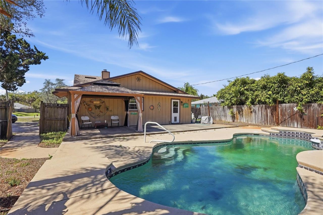 Photo 2 of 20: Nearly quarter acre lot features pool and spa in fenced-in backyard.