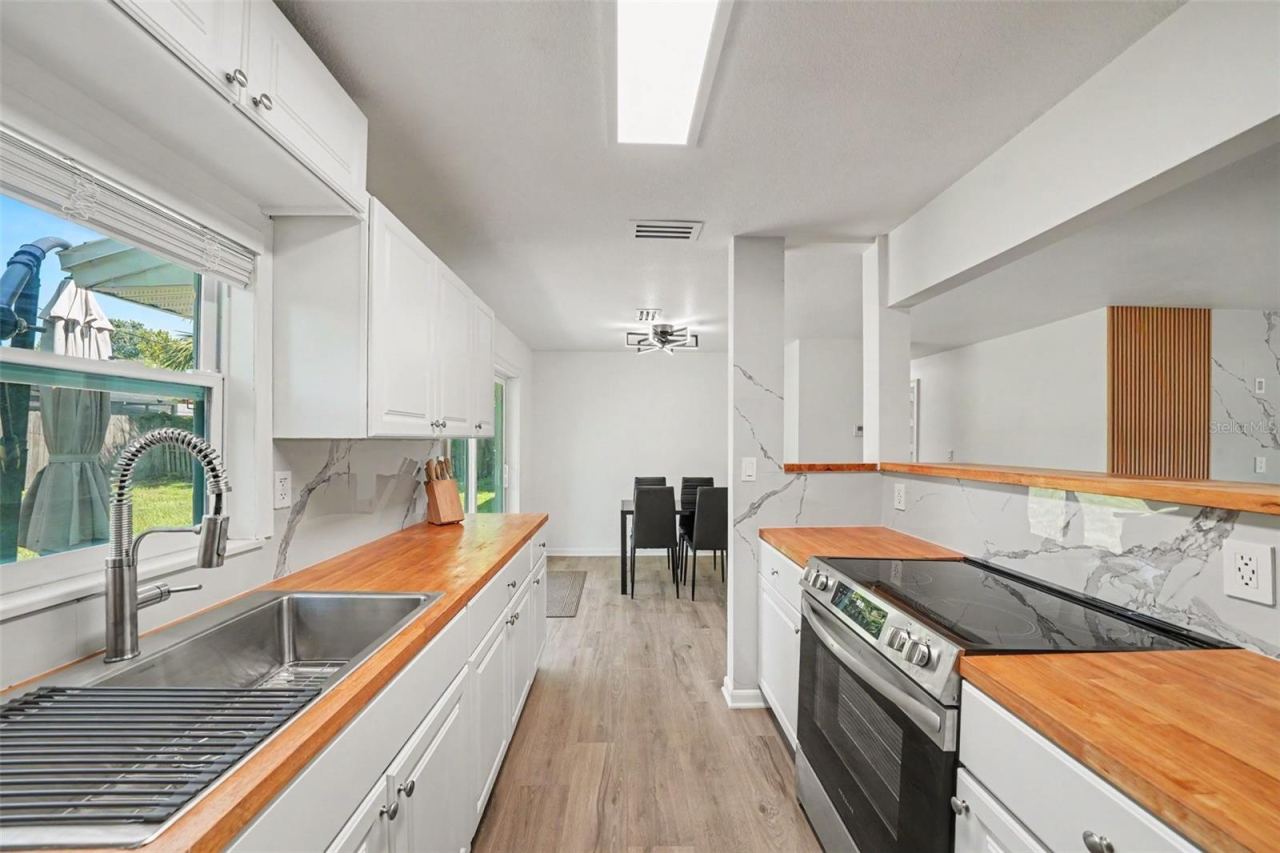 Photo 10 of 20: Kitchen has a nice window looking into the backyard. Very airy space.