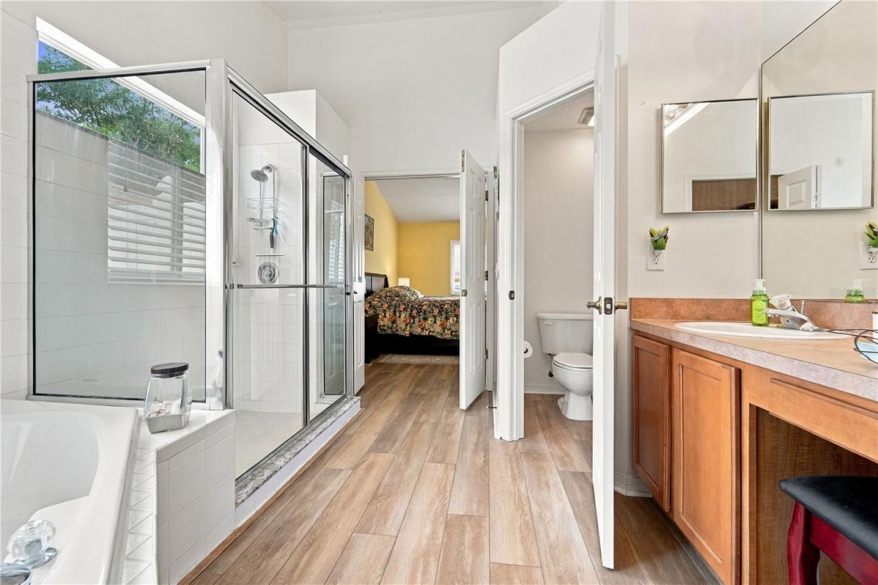 Photo 18 of 20: Another view of primary bathroom looking from walk-in closet