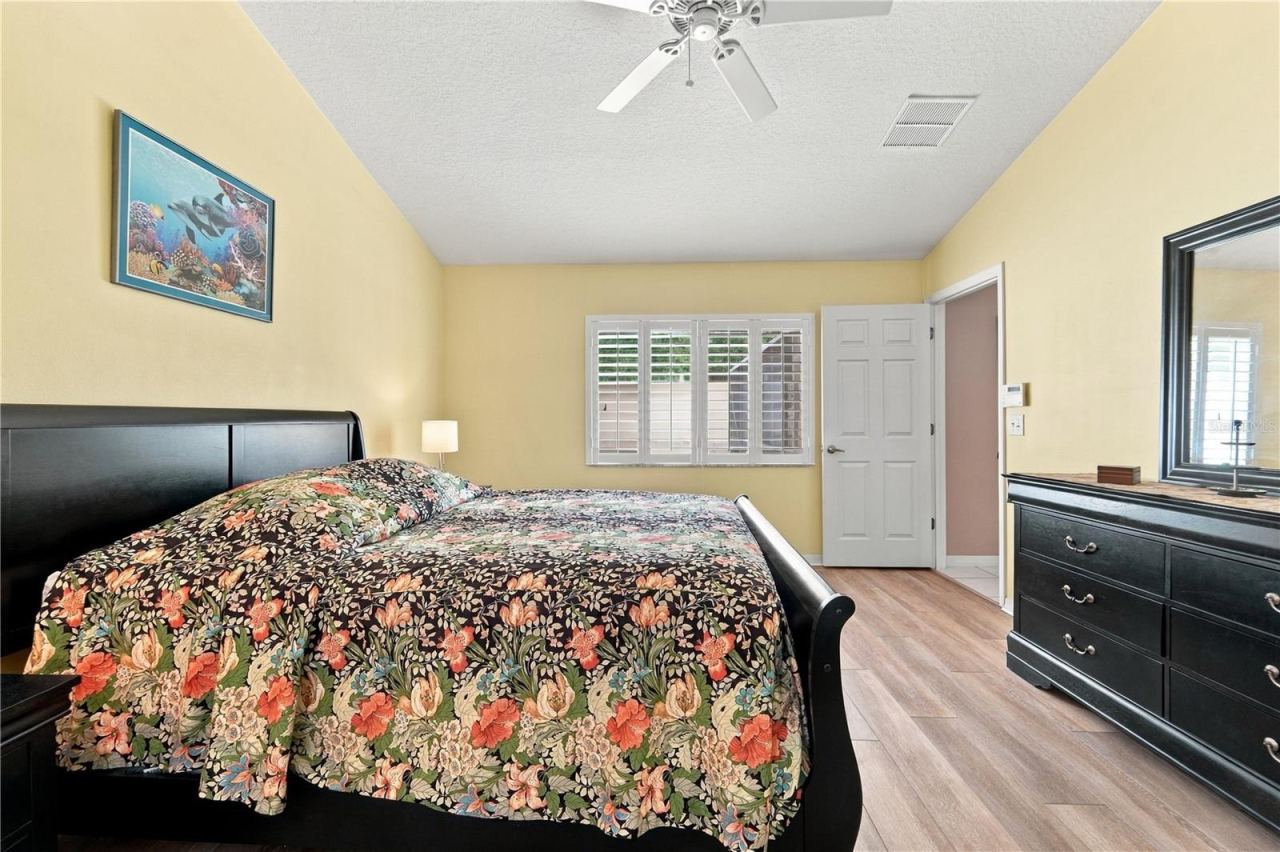 Photo 15 of 20: Primary bedroom with luxury vinyl plank flooring.