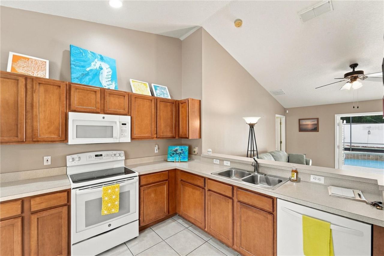 Photo 14 of 20: Kitchen is well designed so you can check on your guests in the pool area