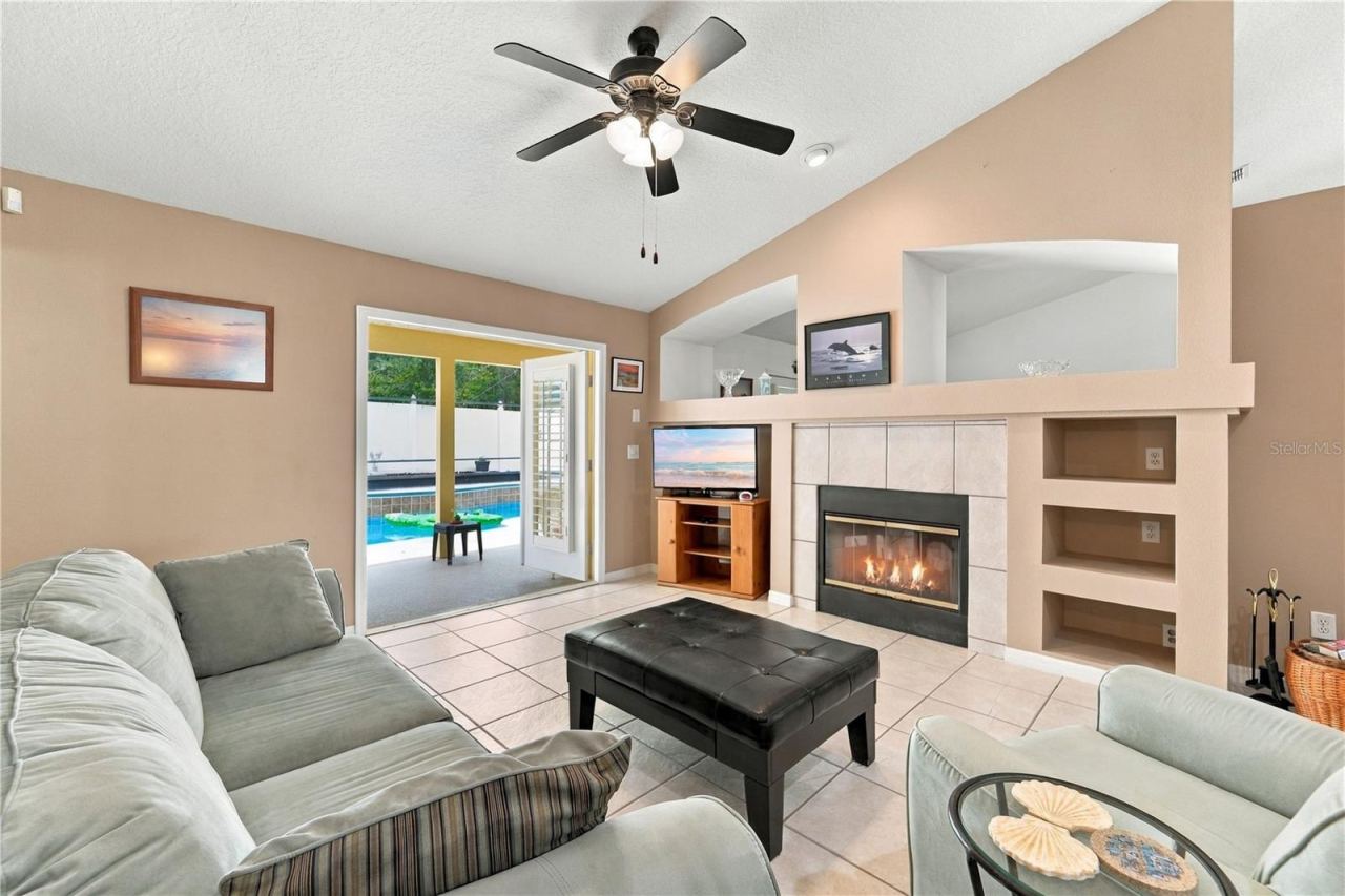 Photo 11 of 20: Family room with French doors open to the pool area.