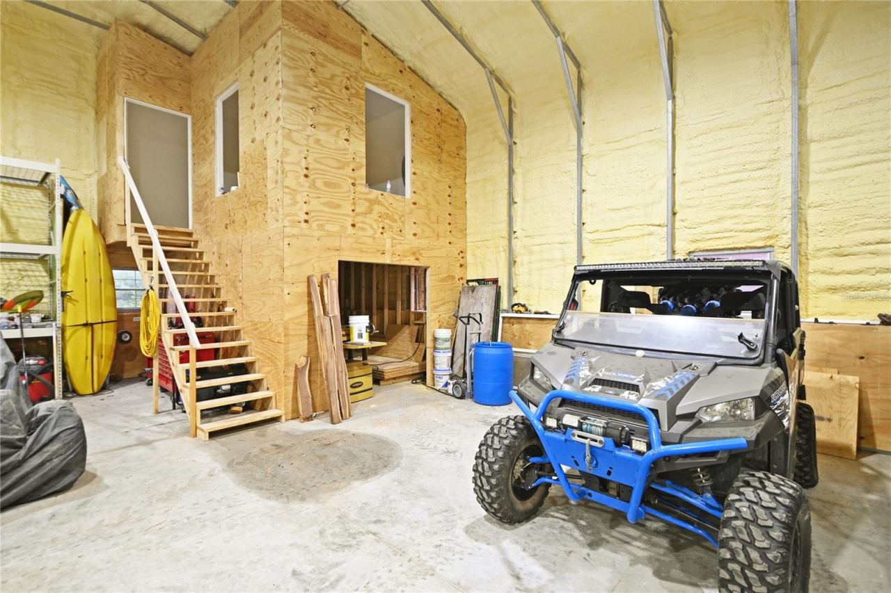 Photo 16 of 20: There is an upstairs nearly finished office space. Only needs two interior windows and HVAC.