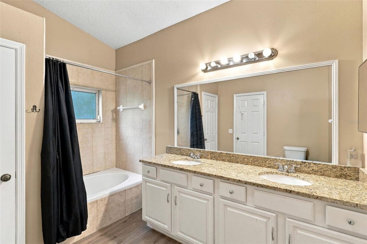 Photo 17 of 20: Primary bathroom, double vanity, large soaking tub and shower.