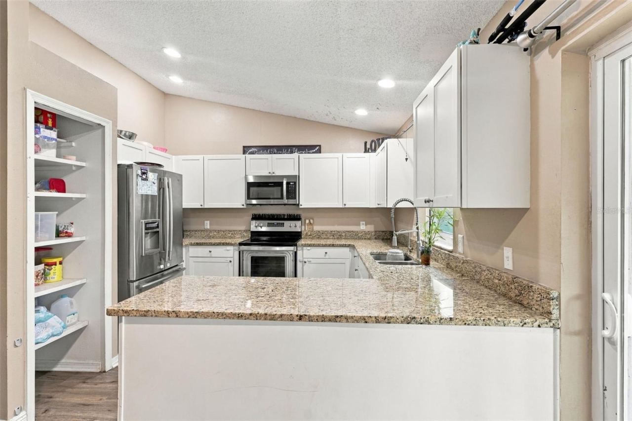 Photo 5 of 20: Stainless Steel appliances, stone countertops.