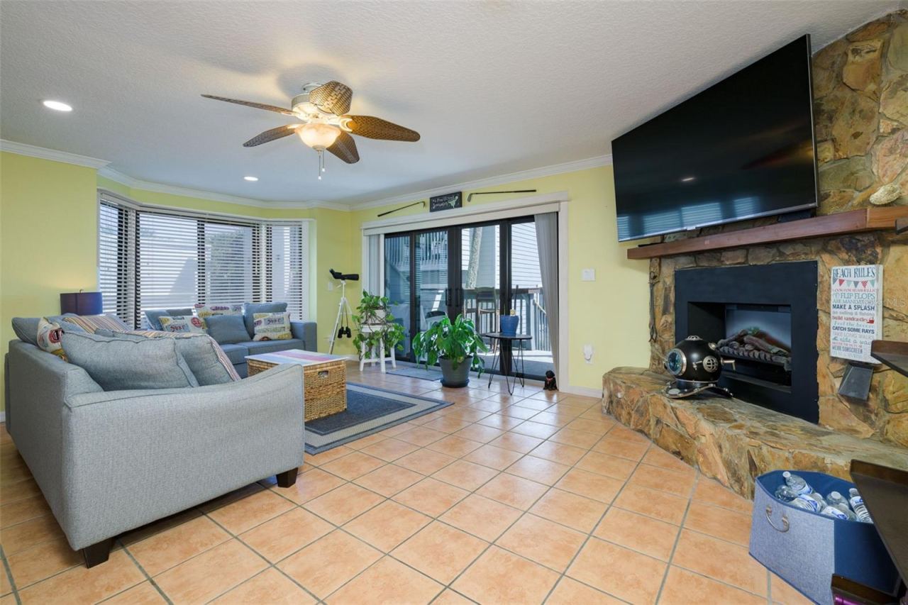 Photo 5 of 20: Fireplace in Living room with a fantastic deck with direct ocean views