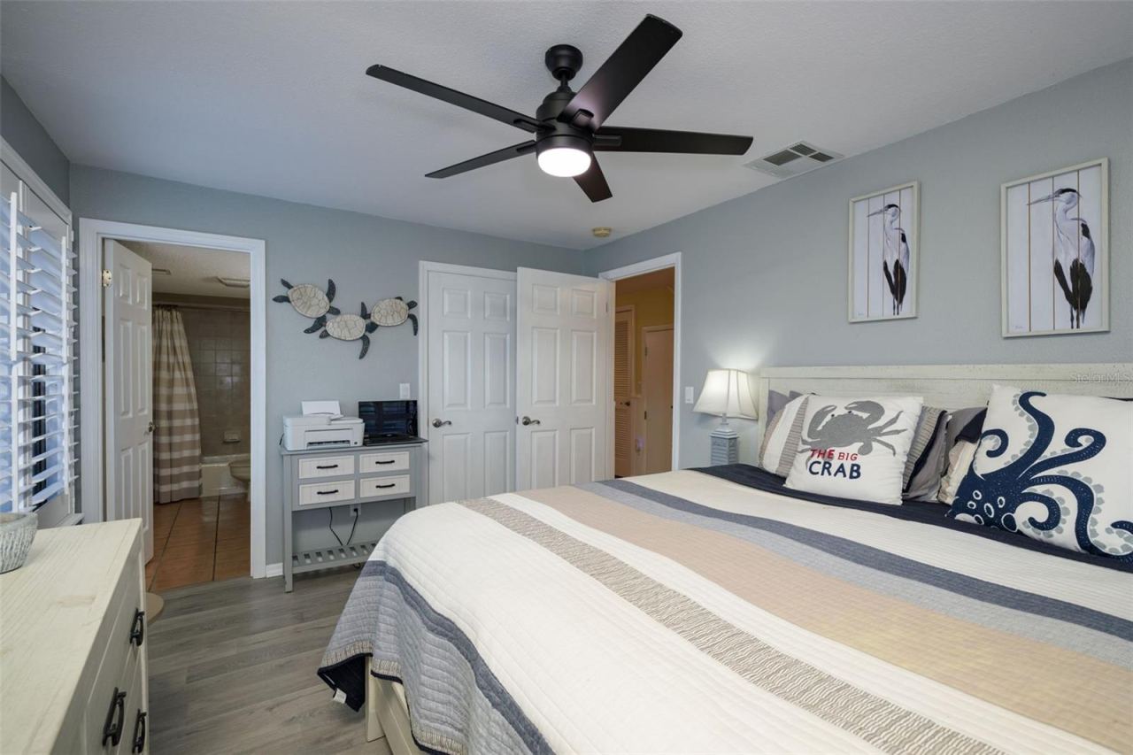 Photo 12 of 20: Primary bedroom on first floor with ensuite bathroom and a large walk in closet