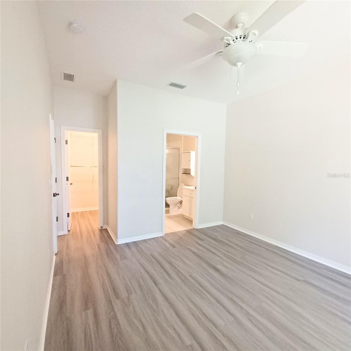Photo 7 of 17: Primary Bedroom with separate walk in closet.