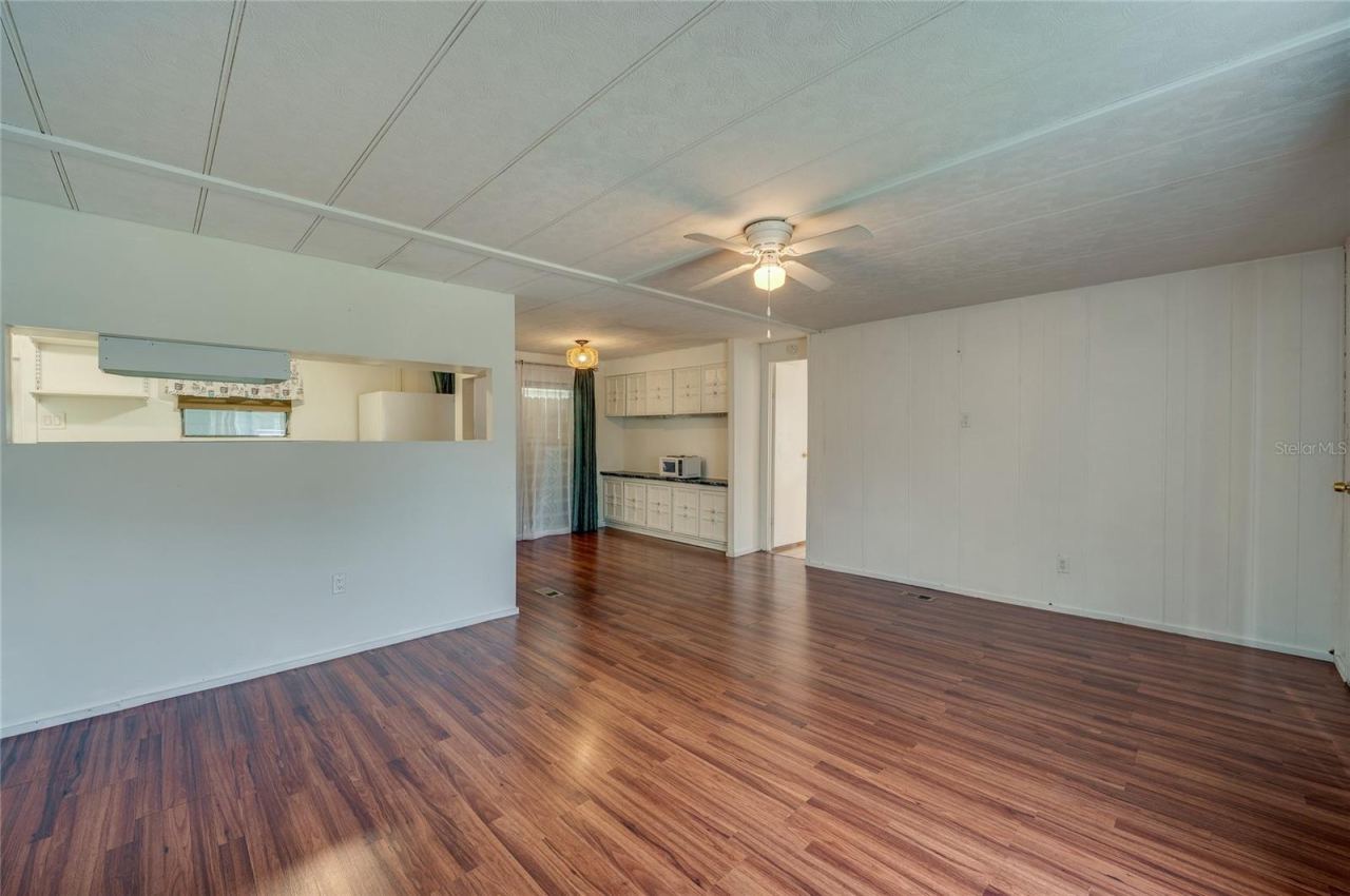 Photo 4 of 20: Open and flexible interior layout provides ample room for separate living and dining zones, with a convenient pass-through to the kitchen.