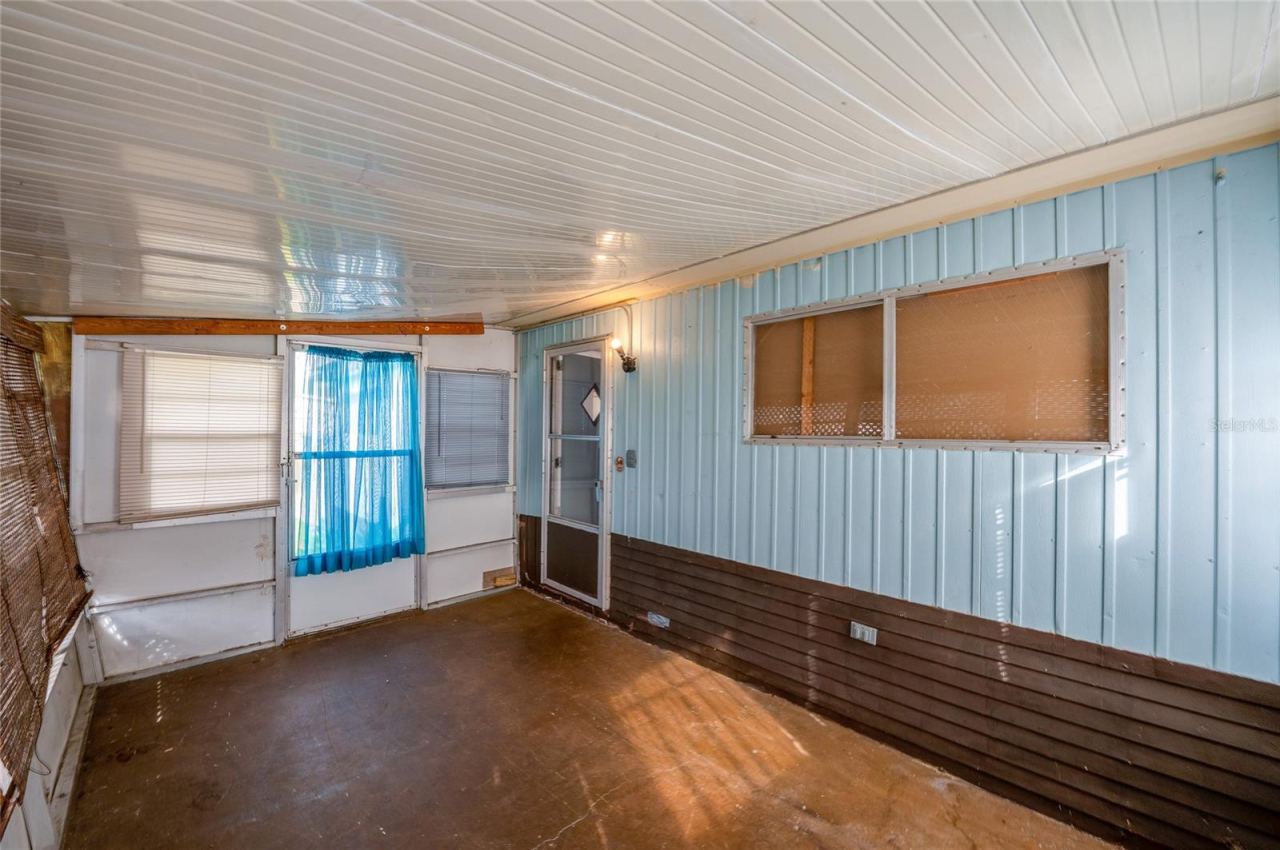 Photo 20 of 20: Another view showcases the porch’s generous proportions and direct access to the home, offering additional space for relaxing or casual use.