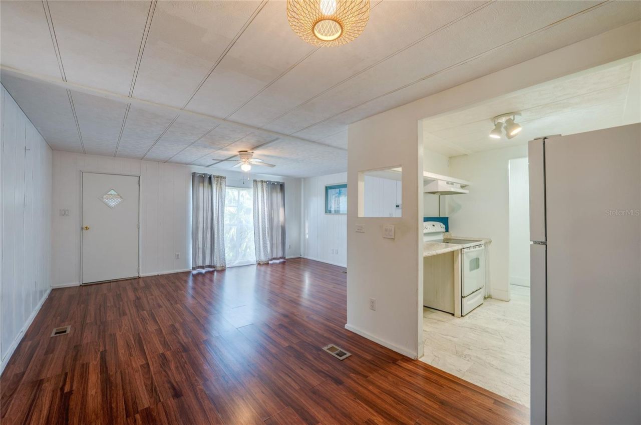Photo 6 of 20: Spacious main living area offers an open layout with abundant natural light and direct connection to the kitchen, creating flexible options for everyday living and dining.