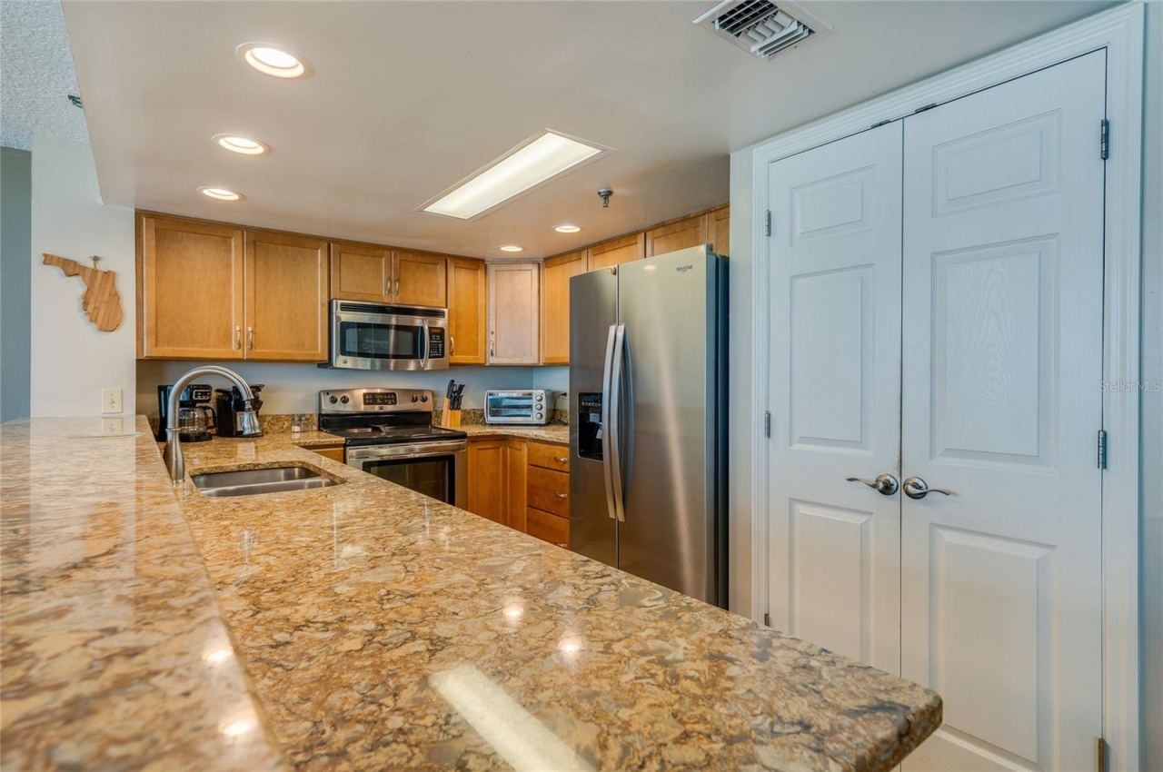 Photo 18 of 20: Stainless steel appliances and abundant cabinetry make this kitchen as functional as it is stylish.