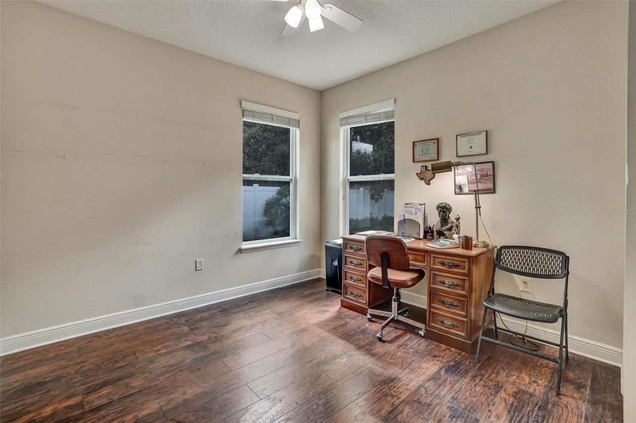 Photo 19 of 20: Third BedroomSpacious third bedroom with wood-look flooring, ceiling fan.