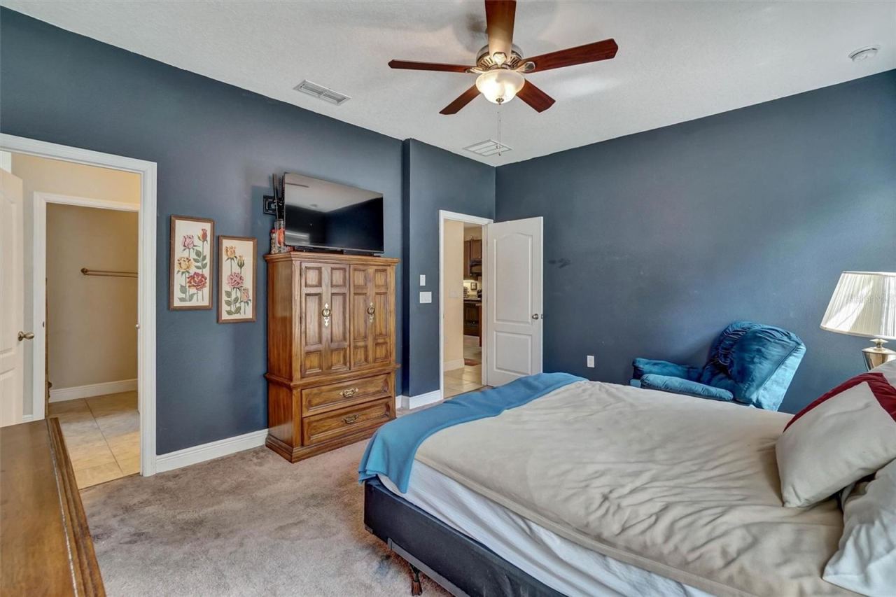 Photo 13 of 20: Bedroom ViewComfortable primary bedroom featuring a ceiling fan and ample storage.