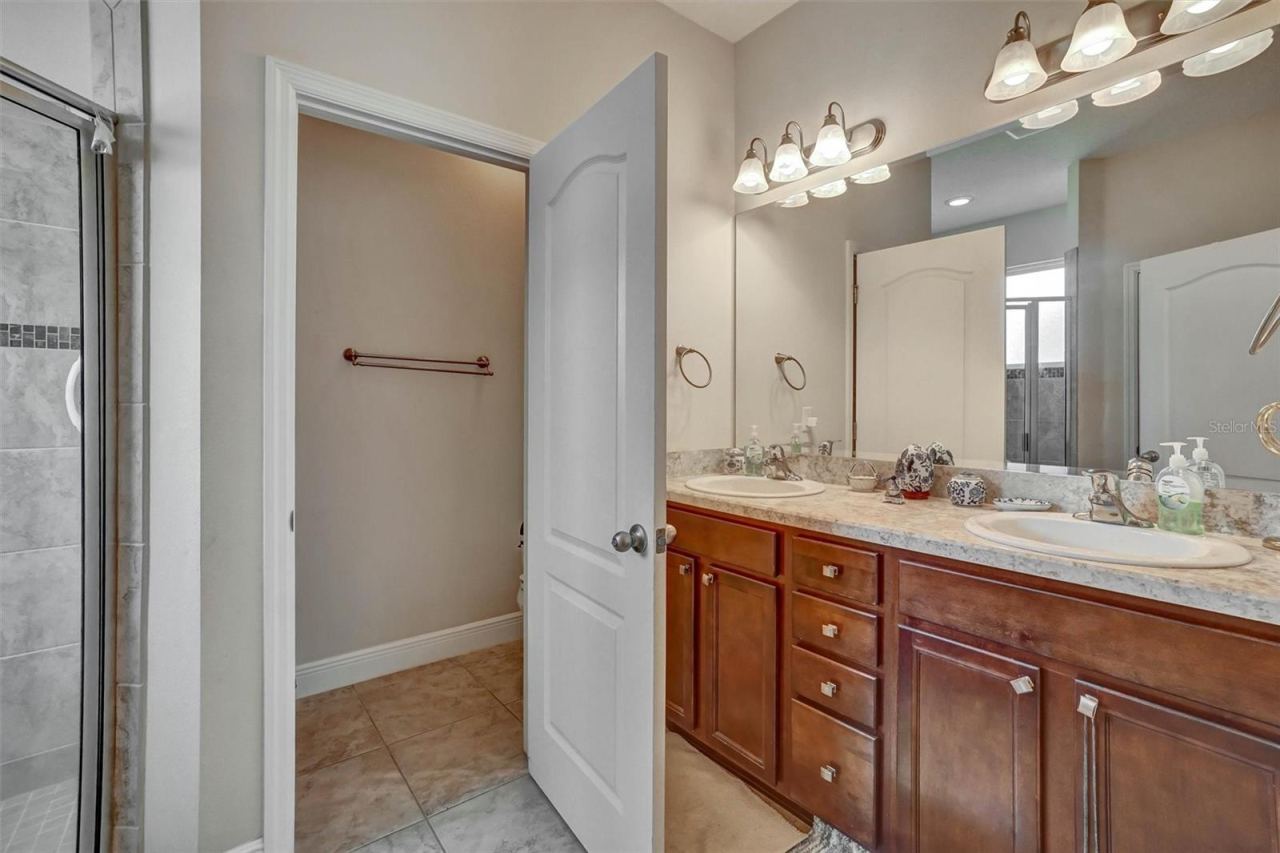 Photo 14 of 20: Primary Bathoom Dual vanity countertops and a large walk in shower