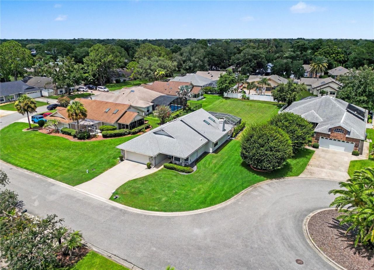 Photo 2 of 20: Ideally situated on a cul-de-sac, this lovely home offers lovely pond views from the front yard