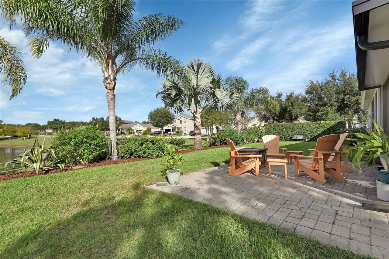 Photo 4 of 20: Paver patio with water and garden view