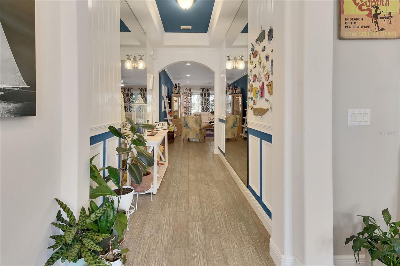 Photo 17 of 20: Coastal foyer with wainscotting
