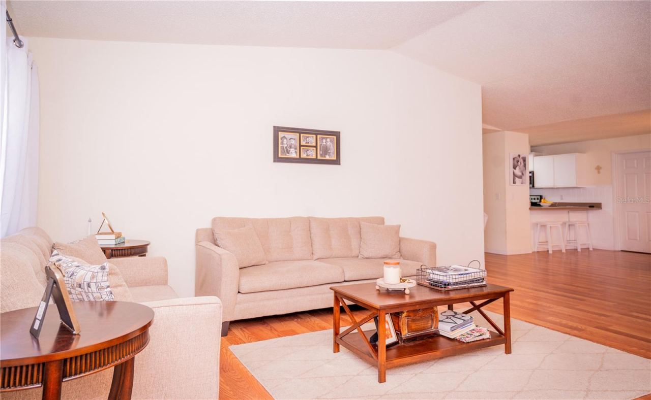 Photo 7 of 20: Front door entry leading into the spacious living room.