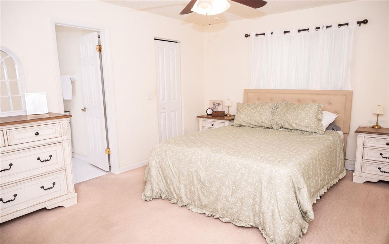 Photo 18 of 20: Primary bedroom view featuring the walk-in closet and primary ensuite bathroom.