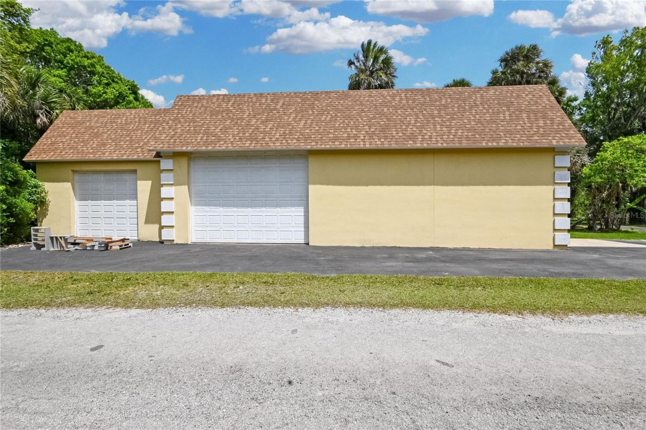 Photo 9 of 20: Barn has SO many possibilities. Includes an office, RV Port, Upstairs storage rooms and more