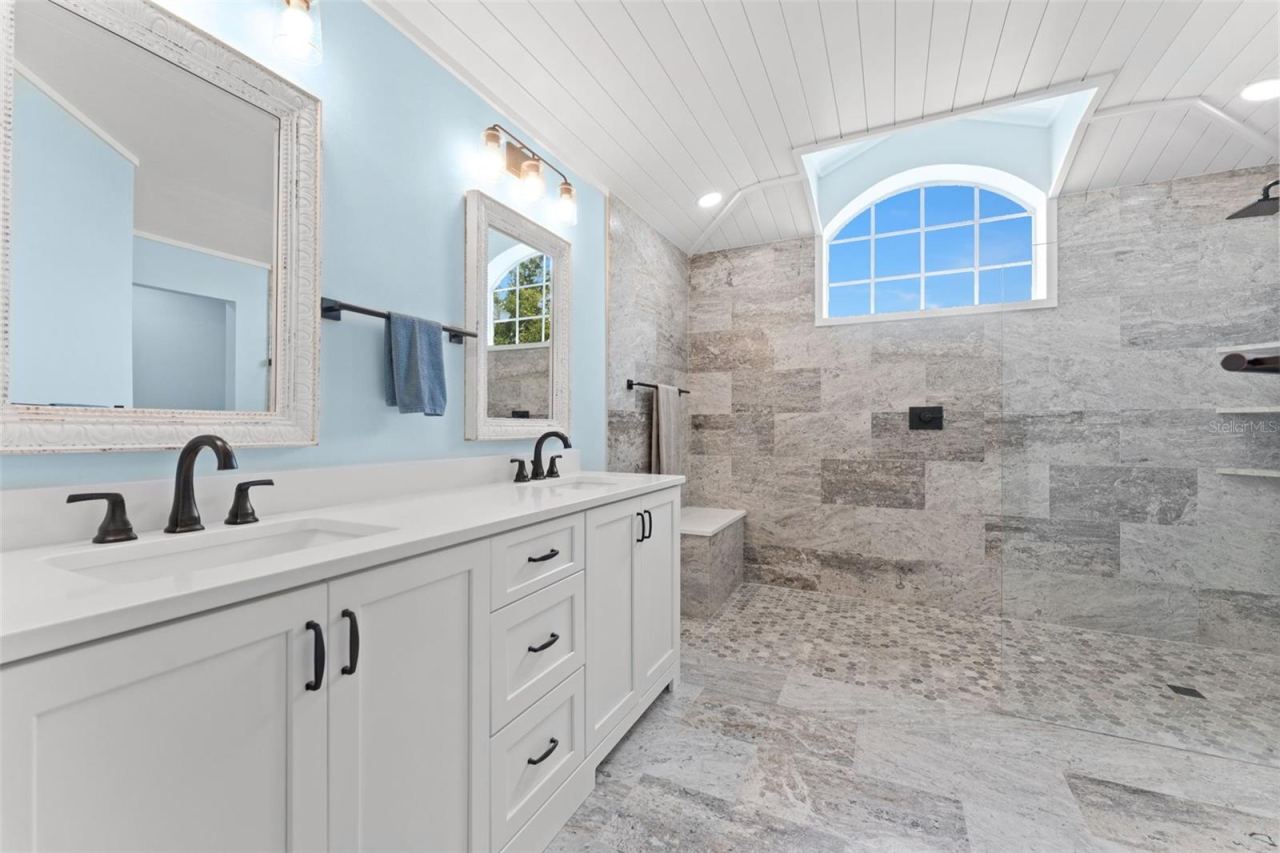 Photo 3 of 20: Primary bathroom with "wet room" shower.