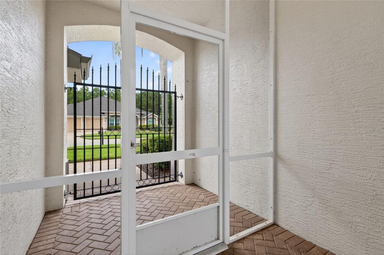 Photo 6 of 20: Front Entryway to courtyard and then courtyard to main