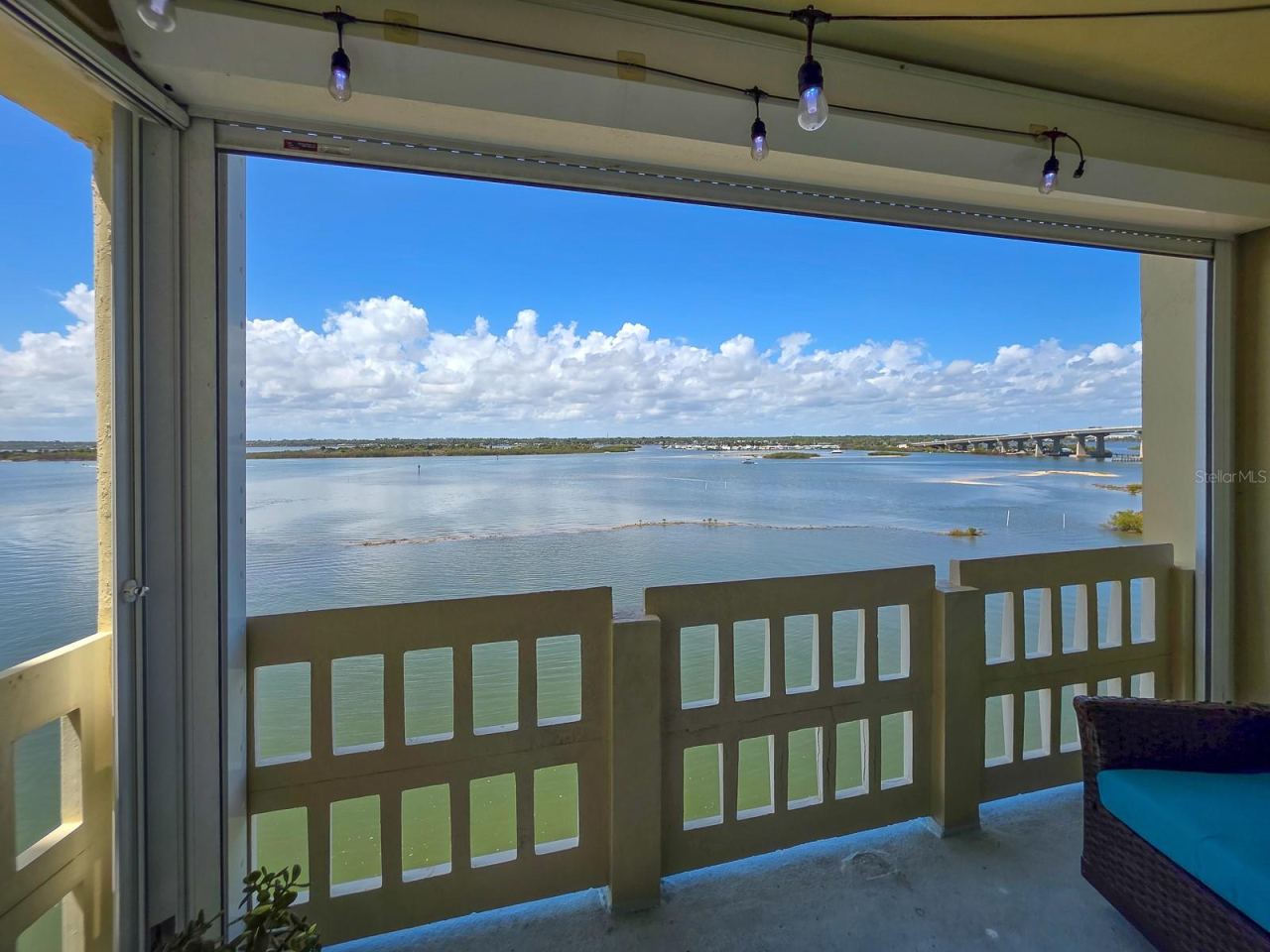 Photo 15 of 20: Covered balcony with electric storm shutters.