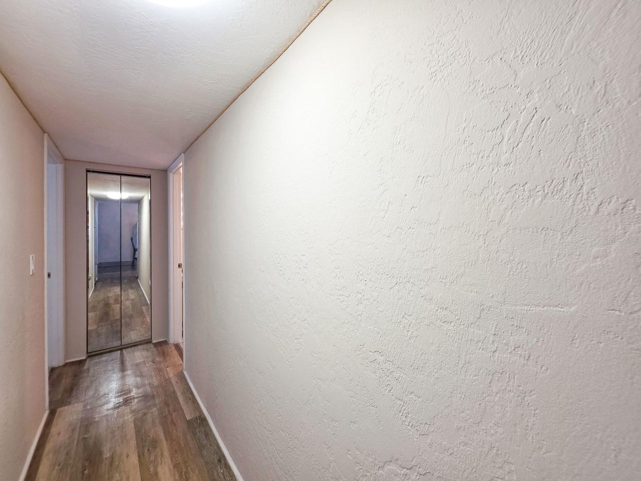 Photo 20 of 20: Hallway to Bedrooms 2, 3 and Guest Bathroom